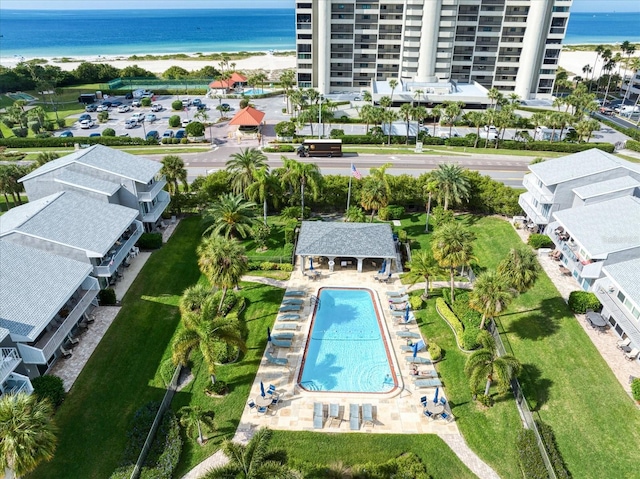 aerial view with a water view and a beach view