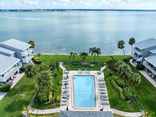 birds eye view of property with a water view