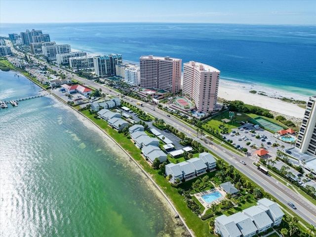 bird's eye view featuring a water view and a view of the beach