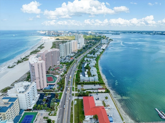 drone / aerial view featuring a water view and a beach view