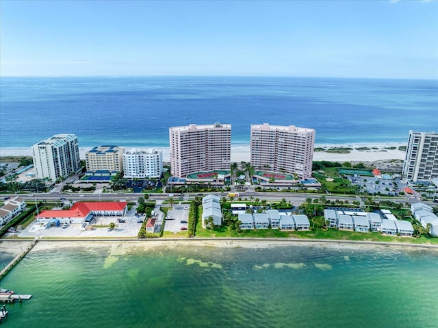 aerial view with a water view and a beach view