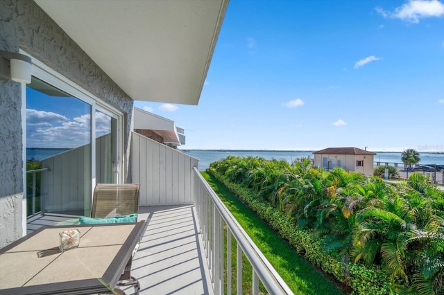 balcony featuring a water view