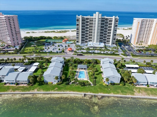 aerial view with a water view and a view of the beach