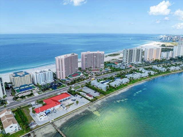 aerial view featuring a water view and a beach view