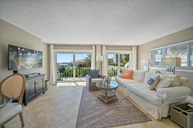 living room with light tile patterned floors and a textured ceiling