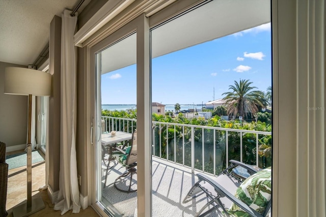 balcony featuring a water view