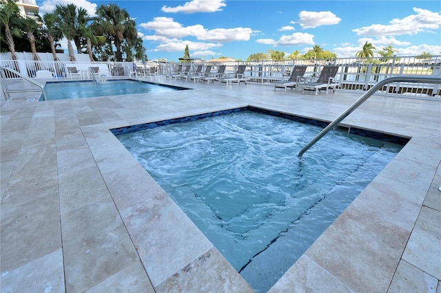 view of pool featuring a community hot tub