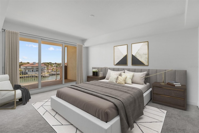 bedroom with a water view, light colored carpet, access to outside, and multiple windows