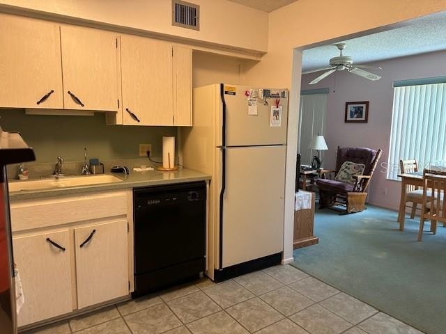 kitchen featuring light colored carpet, ceiling fan, sink, dishwasher, and white refrigerator