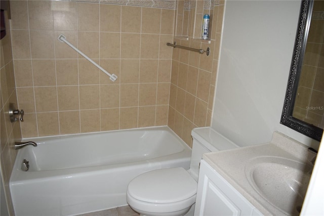 full bathroom with tiled shower / bath combo, tile patterned flooring, vanity, and toilet