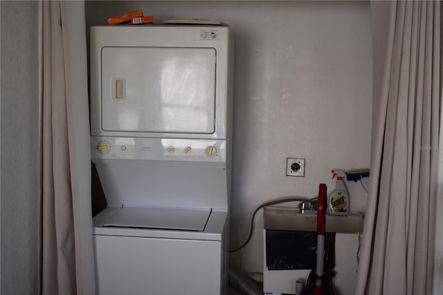 laundry room featuring stacked washing maching and dryer