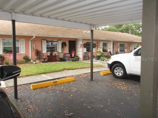 view of parking with a carport