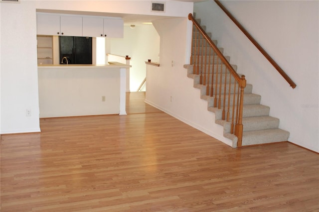 unfurnished living room with light hardwood / wood-style floors