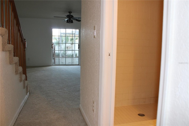 hallway with light colored carpet