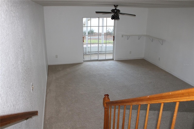 unfurnished room featuring carpet and ceiling fan