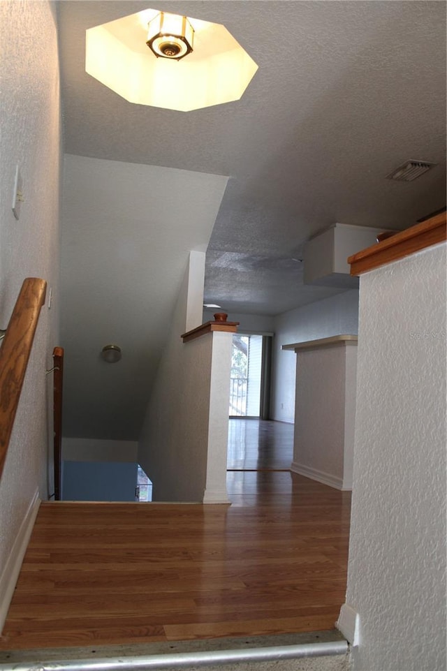 stairs with wood-type flooring