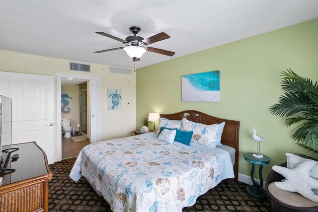 bedroom featuring ceiling fan and ensuite bath