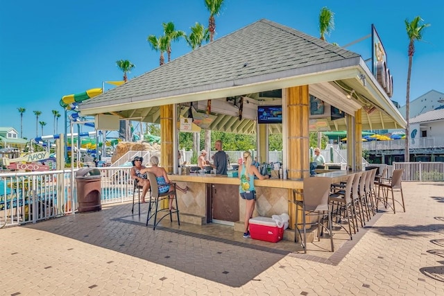 view of patio featuring an outdoor bar and a gazebo