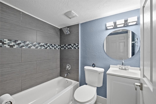 full bathroom with vanity, a textured ceiling, toilet, and tiled shower / bath