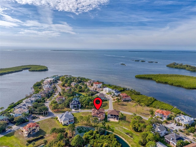 drone / aerial view featuring a water view and a residential view