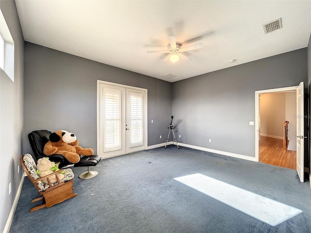 interior space featuring carpet flooring, baseboards, visible vents, and french doors