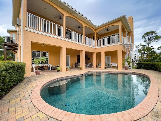 exterior space featuring a ceiling fan, an outdoor living space, and a patio area