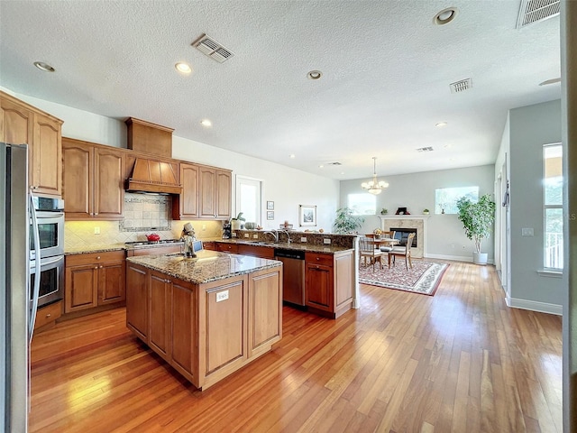 kitchen featuring a healthy amount of sunlight, visible vents, and appliances with stainless steel finishes