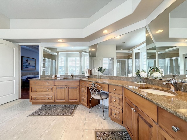 full bathroom with recessed lighting, a shower stall, vanity, and ornate columns