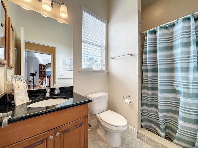 full bathroom featuring tile patterned flooring, toilet, vanity, and a shower with curtain