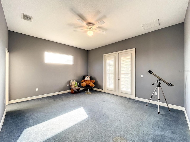 misc room with visible vents, carpet flooring, french doors, and baseboards