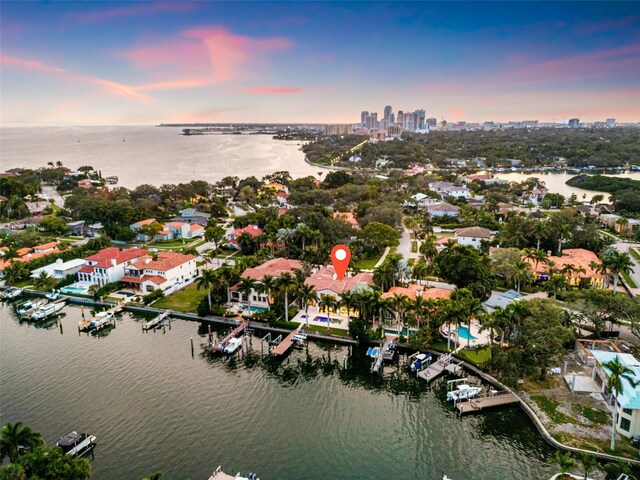 aerial view at dusk with a water view