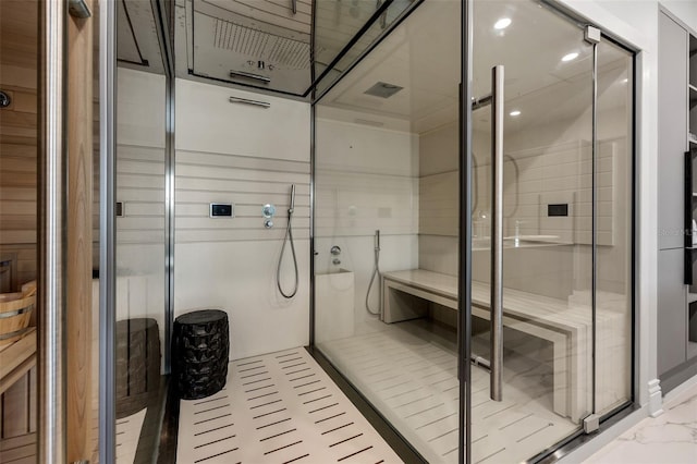 full bathroom with a stall shower and marble finish floor