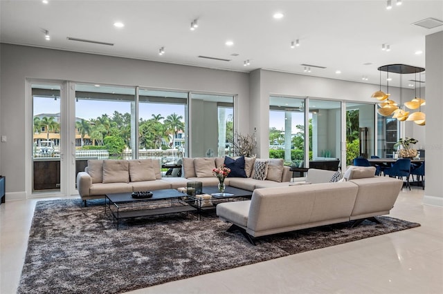 living room featuring baseboards, visible vents, a notable chandelier, and recessed lighting