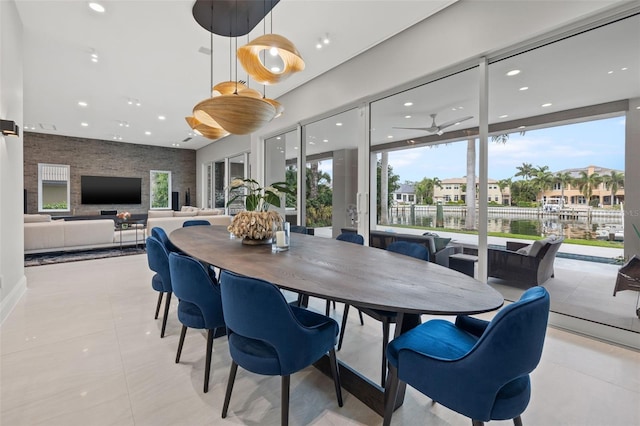 dining area featuring recessed lighting, ceiling fan, a residential view, and light tile patterned floors