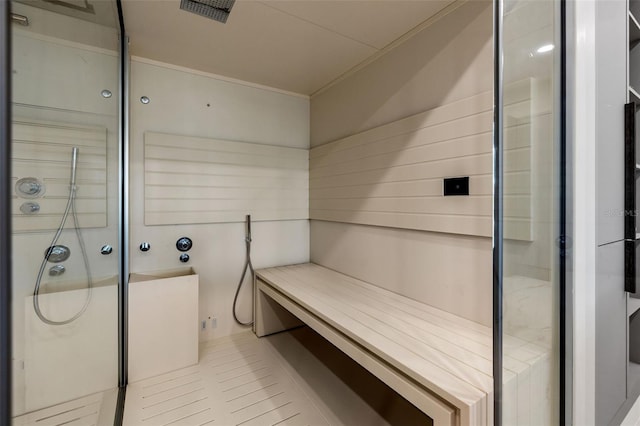 interior space with a stall shower, visible vents, a sauna, and ornamental molding