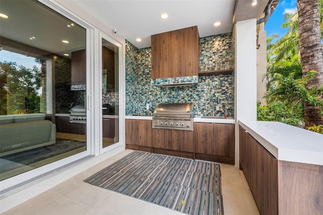 view of patio with a grill and an outdoor kitchen