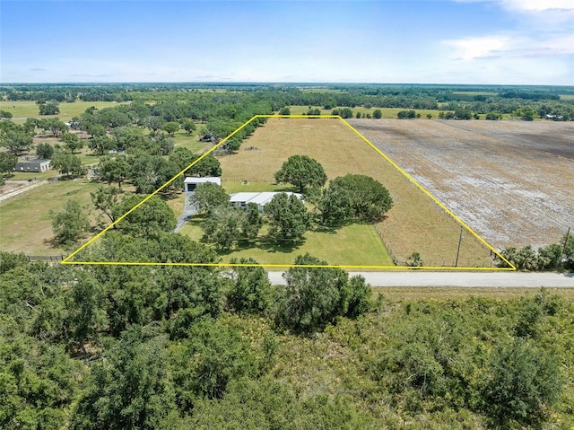 birds eye view of property featuring a rural view