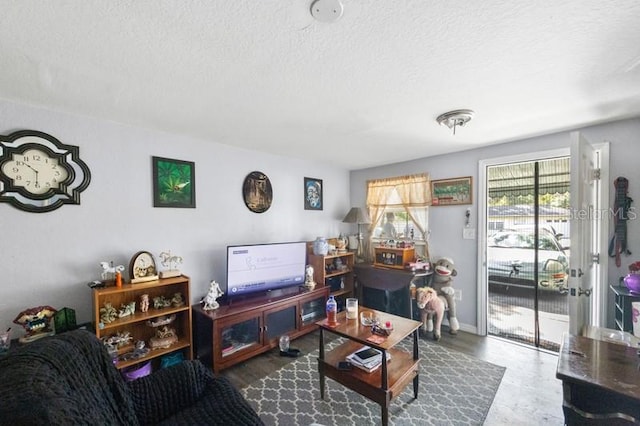 living room with a textured ceiling