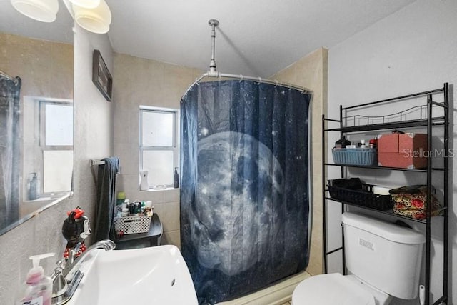 bathroom featuring sink and toilet