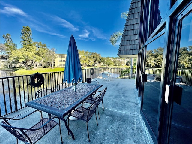 view of patio / terrace featuring a water view