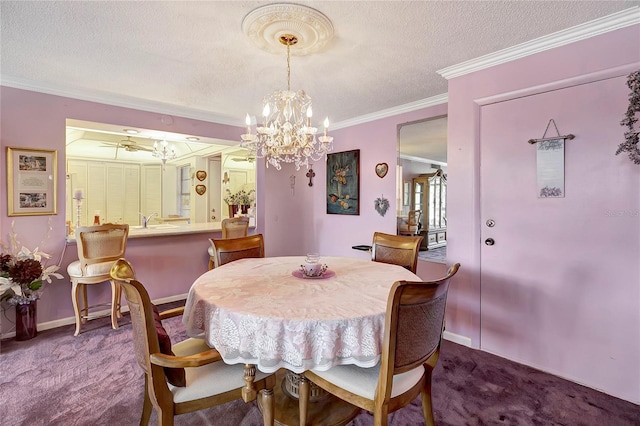 dining area with carpet flooring, ceiling fan with notable chandelier, ornamental molding, and a textured ceiling