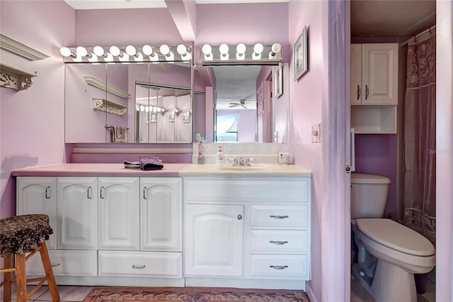 bathroom with tile patterned floors, vanity, and toilet