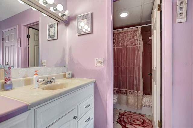 bathroom with a shower with curtain, vanity, and toilet