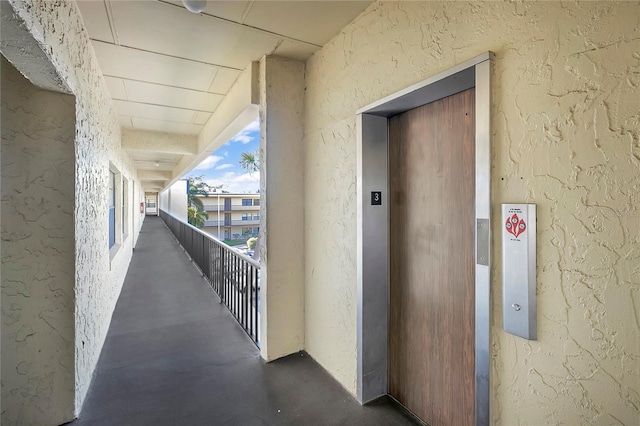 corridor featuring elevator