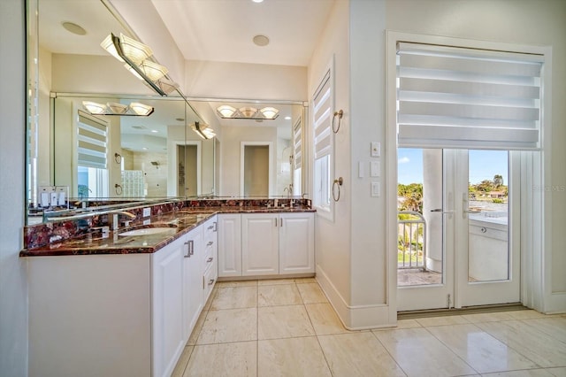 bathroom featuring vanity, walk in shower, and tile patterned floors