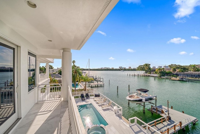 balcony featuring a boat dock and a water view