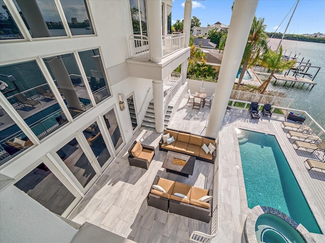 exterior space with outdoor lounge area and a water view