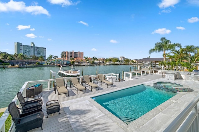 view of pool with a water view and an in ground hot tub