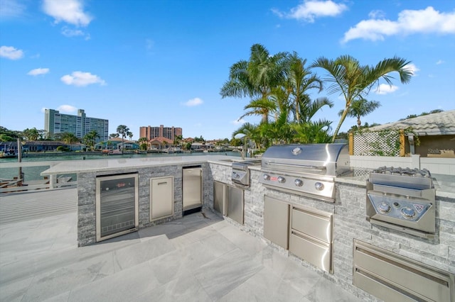 view of patio featuring a grill and exterior kitchen