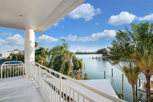 balcony featuring a water view